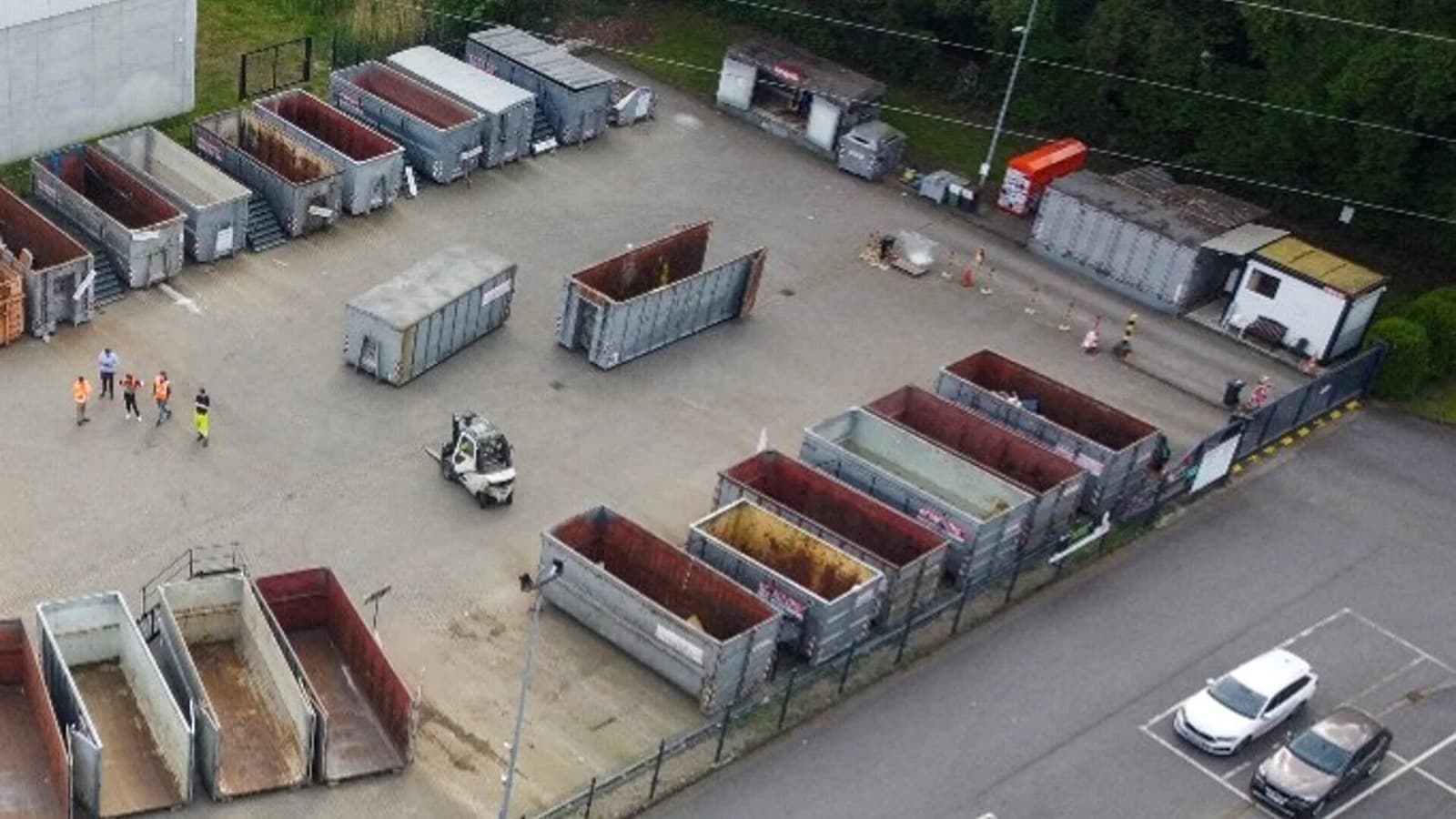 Aerial view of a waste yard with roll-off containers