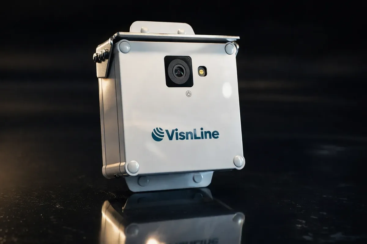 VisnLine AI camera: white weatherproof housing with lens and status light