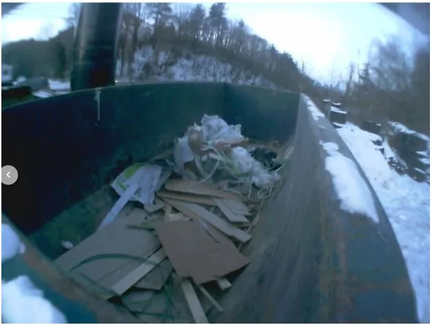 VisnLine camera view of a construction and demolition container in the snow