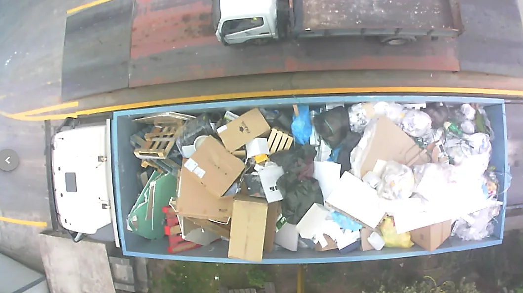 VisnLine camera view of a truck on the weighbridge, its load of cardboard and packaging waste photographed from above